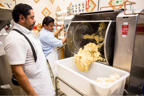 Northgate Market Employee in bakery making dough