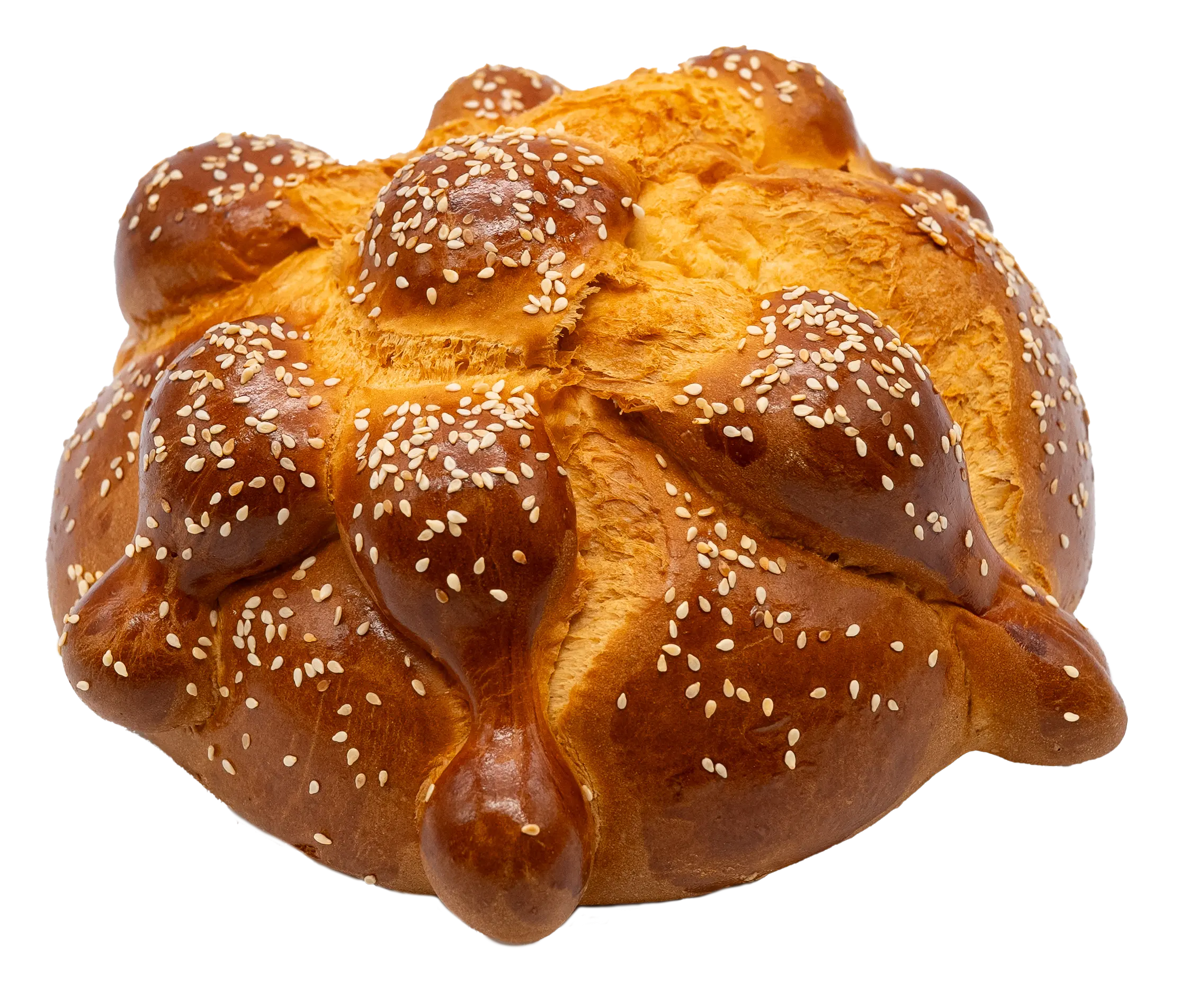 Traditional pan de muerto topped with sesame seeds, featuring bone-shaped dough decorations on top.