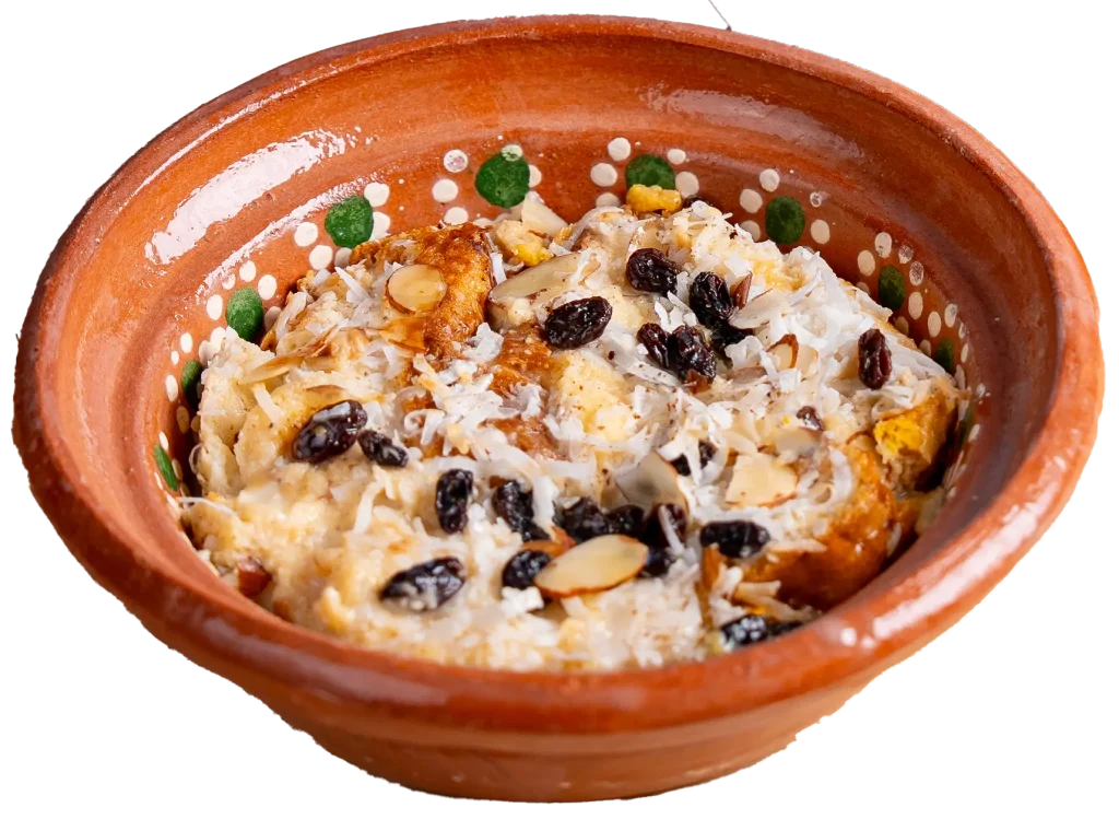 Capirotada Mexican bread pudding with raisins, coconut, and sliced almonds